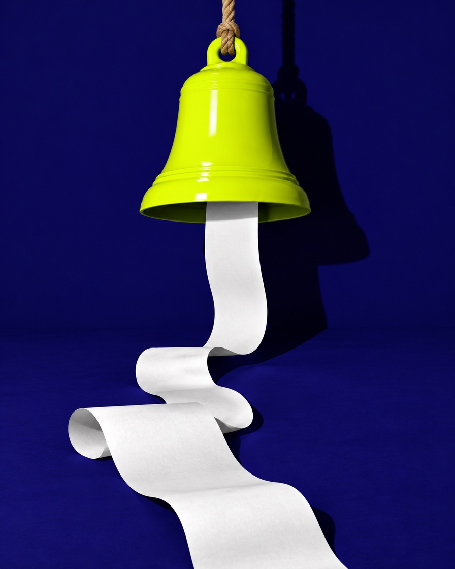 A lime bell hanging from a rope, with a long paper receipt pouring out of it